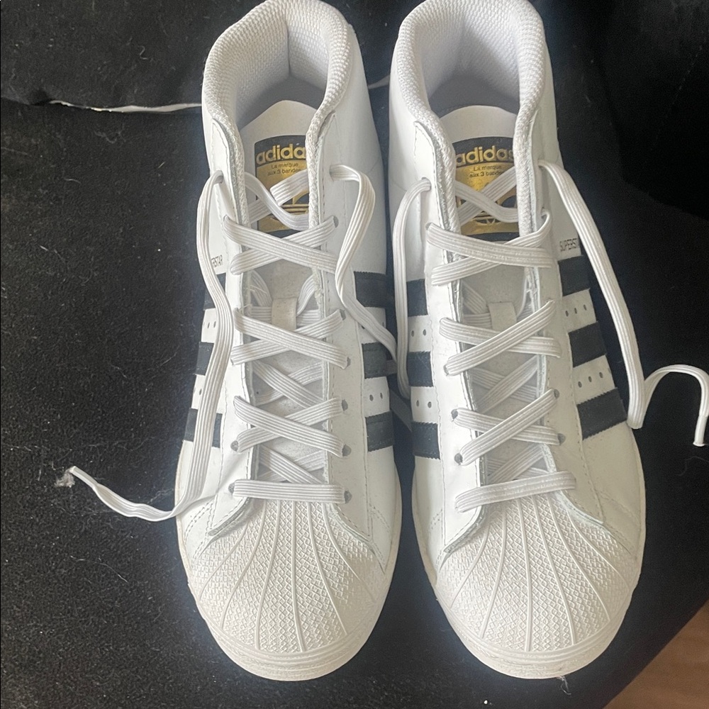 Super Star adidas White Sneakers with Black Stripes and Gold Tongue Logo